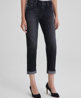 Effortlessly stylish high-waisted black denim jeans with rolled cuffs, perfect for casual and chic outfits.