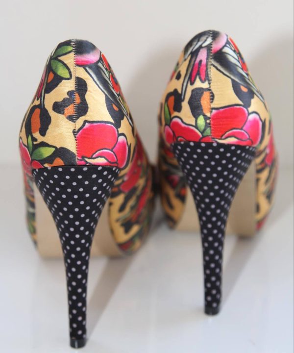 Bold floral and animal print patterned high heel shoes with polka dot soles, designed by KATYAMAKER, showcased on a white background for stylish women's footwear.