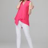 Vibrant pink sleeveless flowy blouse with V-neck paired with white slim-fit pants and nude heels.