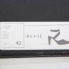 Elegant black high heel shoe on a shoe box label, fashion-forward footwear from the GUSTO collection by REVIE, size 40, stylish and modern women's footwear for trendy outfits.