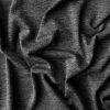 Soft dark gray fabric with a cozy, textured appearance, perfect for handmade clothing or craft projects.