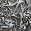 Soft grey fabric with a subtle heather pattern, perfect for sewing and crafting projects. Luxurious and comfortable, ideal for clothing, home decor, and DIY textiles. High-quality knit material.