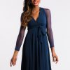 Elegant navy blue dress with sheer long sleeves and a waist tie, perfect for formal or special occasions.