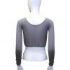 Soft gray cropped long sleeve top with comfortable stretch fabric, perfect for casual wear or layering. Features a wide neckline and gathered hem for a relaxed fit. Ideal for modern, stylish outfits.