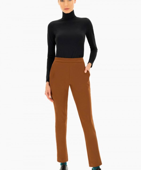 Soft black turtleneck sweater paired with stylish brown tailored pants, showcasing modern women's workwear fashion. Perfect for office or casual outings with a sleek, professional look.