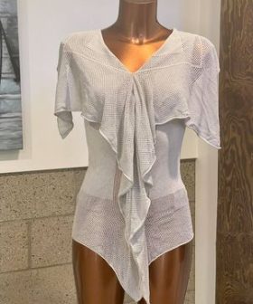 Lightweight white knit cover-up with draped ruffle design, perfect for beach or resort wear, by katyamaker.