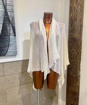 Elegant, lightweight women's shawl or wrap showcased on a mannequin, perfect for layering and adding a touch of sophistication to any outfit, ideal for spring or fall fashion.