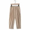 Striped beige and brown wide-leg pants with elastic waistband on a clothing hanger.
