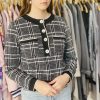 Black and white plaid women's cardigan with pearl buttons, stylish and cozy knitwear for fall and winter, ideal for casual or professional outfits.