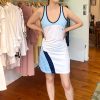 Sporty tennis dress with blue and white color block design, sleeveless athletic wear, casual sport dress for women, versatile tennis and workout outfit, made of lightweight, breathable fabric for active lifestyles.