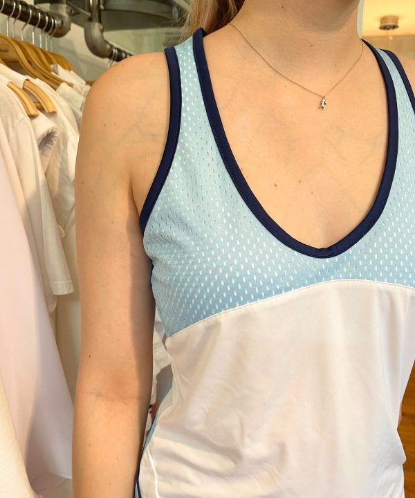 Cotton sleeveless top, fashion photography, casual summer apparel, blue and white sleeveless blouse, trendy women's clothing, designer tank top, stylish summer outfit, comfortable summer wear, women's casual tops, retail fashion photography.