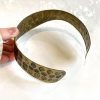 Vintage leopard print metallic cuff bracelet, statement jewelry piece featuring bold animal print design, perfect for fashion accessories and handmade jewelry enthusiasts.