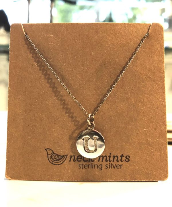 Silver initial pendant necklace with a letter "U" on a delicate chain, displayed on a kraft jewelry card from Nectar Mints Sterling Silver, perfect for personalized jewelry and gift-giving.
