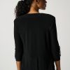 Elegant black women's blazer with button details on the sleeves, showcasing sophisticated office or casual wear for women. Perfect for stylish and professional outfits.