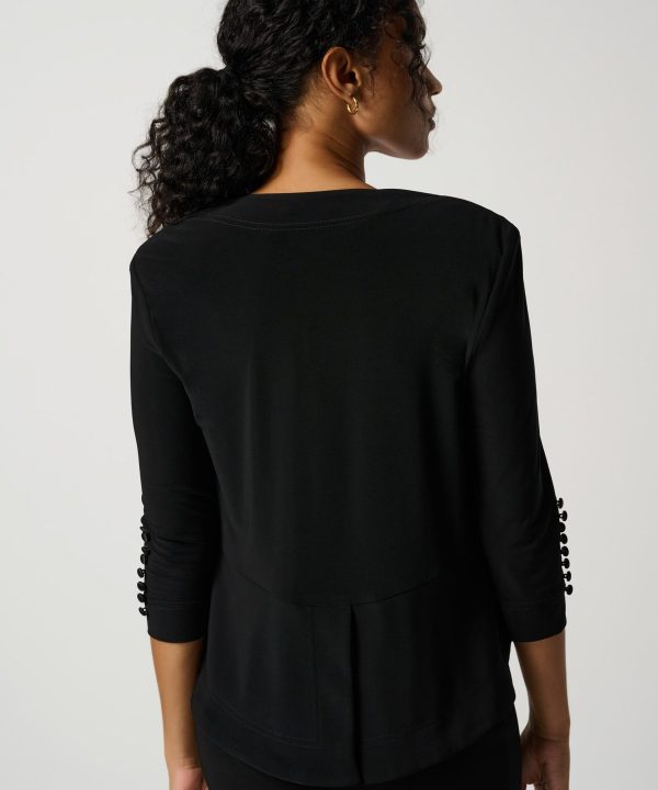 Elegant black women's blazer with button details on the sleeves, showcasing sophisticated office or casual wear for women. Perfect for stylish and professional outfits.