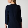 Elegant navy blue blouse with button details on sleeves, tailored fit, suitable for stylish workwear or casual chic outfits. Perfect for modern women seeking versatile fashion pieces.