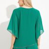 Flowy emerald green blouse with cape sleeves and metallic trim, perfect for elegant occasions or evening wear. Stylish, lightweight, and comfortable, suitable for dressing up or casual chic looks.