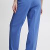 Bright blue tailored women's trousers with a high waist, front pockets, and wide-leg fit, ideal for office wear or casual chic looks.