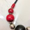 Beaded necklace, handcrafted jewelry, red and black statement necklace, bold jewelry accessory, unique handmade jewelry piece.