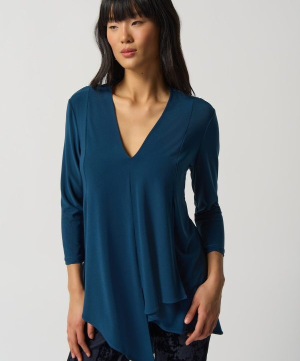 Flowy blue V-neck women's blouse with layered hem, stylish and comfortable for office or casual wear, designed by katyamaker for modern fashion.