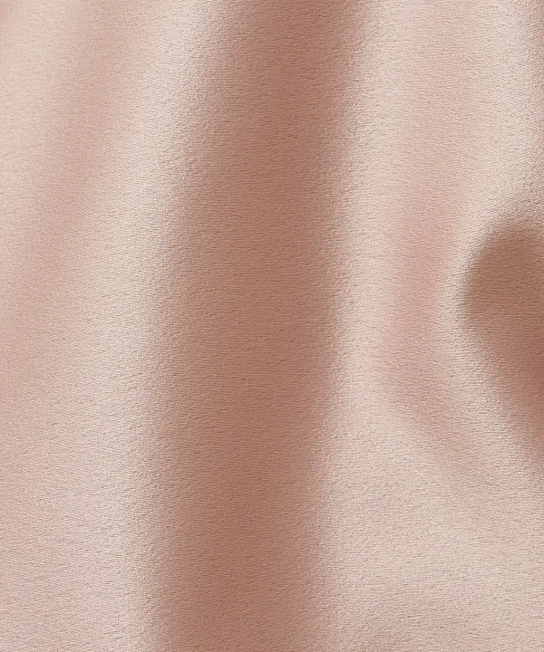 Silky rose gold satin fabric texture, luxurious material for fashion and interior design, smooth draping and elegant appearance.