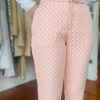 Pink geometric print wide-leg pants featuring a high waist, tailored fit, and stylish design, perfect for fashion-forward casual or office wear.