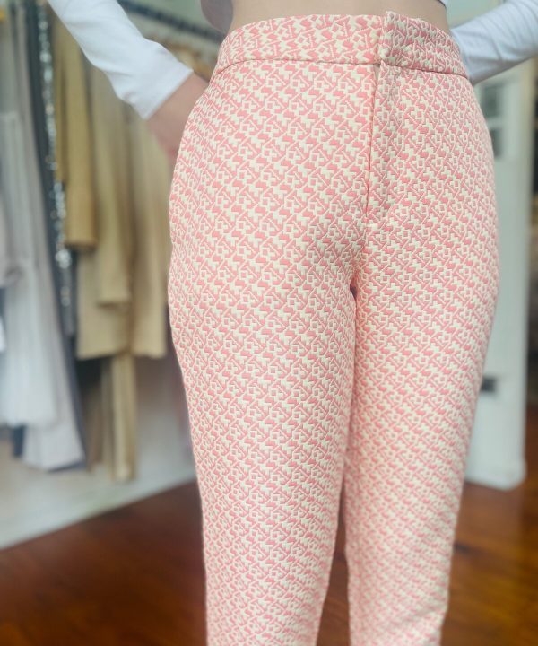 Pink geometric print wide-leg pants featuring a high waist, tailored fit, and stylish design, perfect for fashion-forward casual or office wear.