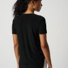 Women’s black athletic t-shirt, back view, comfortable activewear for women, seamless sports top, versatile workout clothing for women, modern athletic fashion.