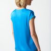 Silk blue satin blouse for women, casual yet elegant fashion, soft fabric, versatile top, stylish women's clothing for office and everyday wear.