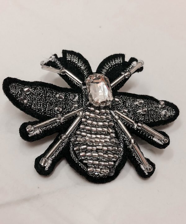 Beaded bee brooch with black lace wings and rhinestone body, handcrafted jewelry, elegant accessory, unique statement pin, artisan jewelry piece.