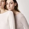 Soft neutral-toned long sleeve shirts for women, showcasing comfortable and minimalist fashion styles.