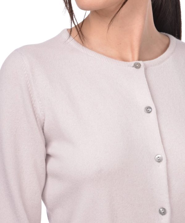 Elegant women's beige button-up cardigan featuring a round neckline, soft knit fabric, and classic pearl-like buttons, perfect for sophisticated and cozy everyday wear.