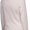 Soft cream-colored knit long-sleeve sweater, versatile and comfortable for casual wear, featuring a classic round neckline, perfect for layering or wearing alone for a cozy everyday look.