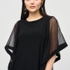 Silk black blouse with sheer mesh sleeves for women, modern elegant fashion, stylish women's top, designer clothing, trendy women's apparel, catya maker collection, sophisticated evening wear, contemporary women's wardrobe, luxury fashion statement, high-quality apparel for women.