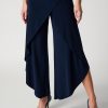 Wide-leg navy blue wrap pants with ruffle details, perfect for stylish office or casual wear.
