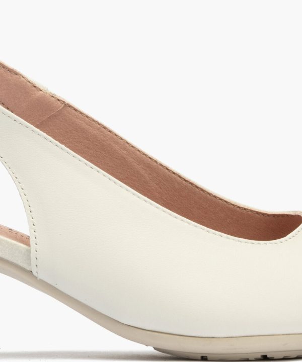 Elegant women's slingback heel with gold tip detail, cream leather upper, blush pink ankle strap with adjustable gold buckle, stylish and comfortable for special occasions or stylish everyday wear.