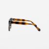 Tortoiseshell eyeglasses with clear lenses on white background.