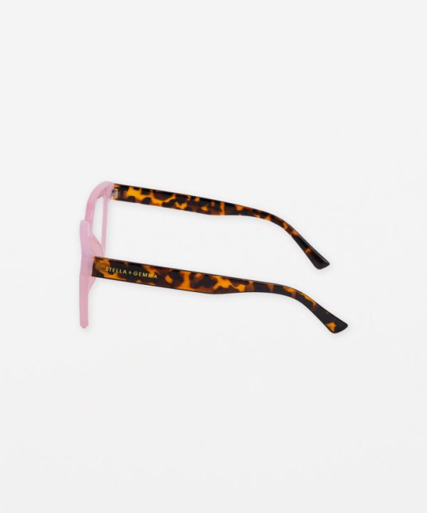 Pink and tortoise shell trendy eyeglasses with "Stella + Gemma" branding, stylish accessory for casual and fashionable looks.