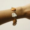 Handmade boho pearl and gemstone bracelet, featuring natural shell and stone accents, perfect for beach-inspired jewelry lovers. Ideal for casual and chic summer accessories.