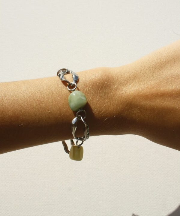 Handcrafted jewelry bracelet with colorful beads, silver links, and modern design, perfect for stylish accessories or gift ideas.