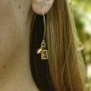 Elegant gold hoop earring with rectangular gemstone charm, styled with a small gold seashell detail, perfect for trendy women's jewelry.