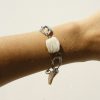 Handmade jewelry bracelet featuring white seashells and silver accents, perfect for beach-inspired fashion and boho accessories, crafted by katyamaker.