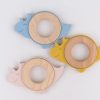 Colorful baby teething rings with cute dinosaur designs, made from wood and silicone, perfect for infants’ teething needs and sensory development.