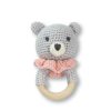 Soft gray crocheted teddy bear baby teething toy with pink collar and wooden ring, handmade from organic cotton, perfect for infant sensory play and teething relief, ideal for baby gift ideas.
