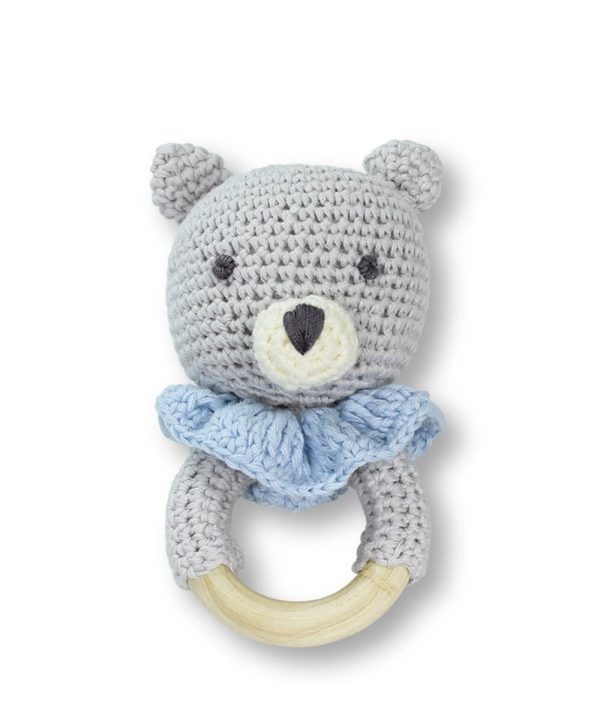 Soft gray crocheted bear-shaped baby teether with wooden ring and blue scarf, perfect for infant sensory play, teething relief, and adorable nursery decor.