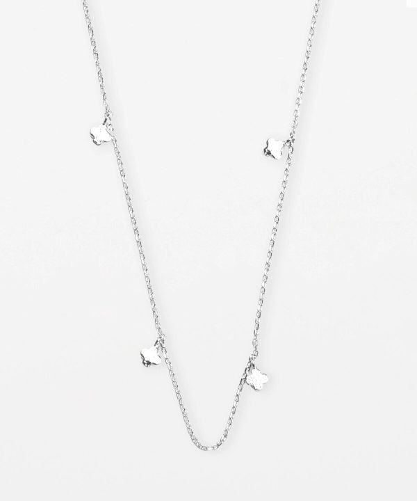 Delicate silver layered necklace with small clover-shaped charms, perfect for minimalist jewelry lovers, made by Katyamaker, a renowned designer for handcrafted, stylish accessories.