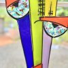 Vivid stained glass art featuring colorful abstract glass pieces and geometric shapes, showcasing contemporary design by Katyamaker, perfect for vibrant home decor.