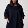 Luxury navy coat with oversized collar, stylish and sophisticated women’s outerwear, perfect for fall and winter fashion.