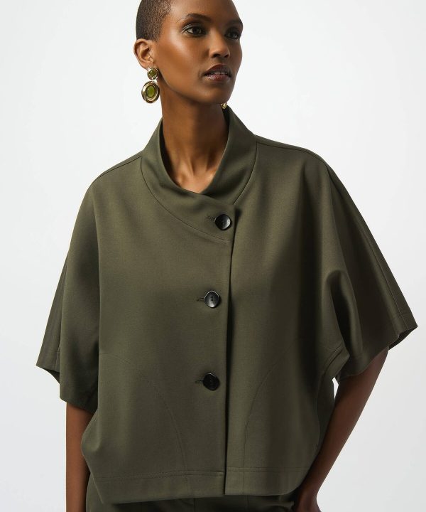 Stylish olive green oversized coat with statement buttons and modern design, perfect for fall and winter fashion.