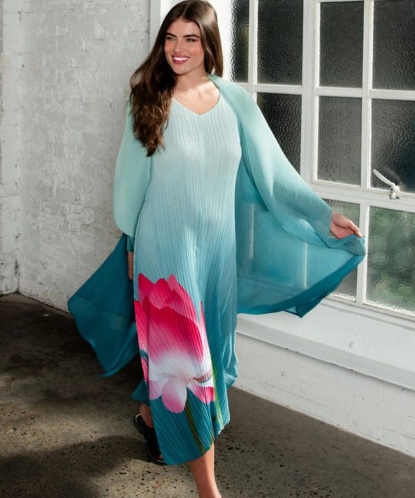 Vibrant turquoise floral maxi dress with pink and white flower print, flowing chiffon fabric, perfect for summer events and garden parties, styled by Katy A Maker.